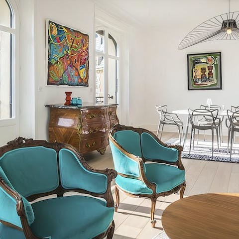 Get comfy in the stylish, light-filled living room with a glass of wine in hand