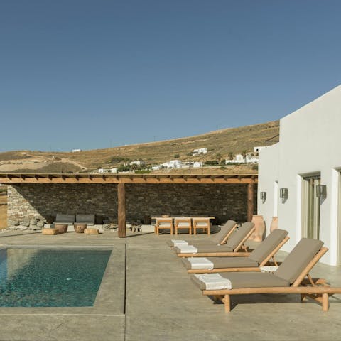 Relax by the pool, good book in hand