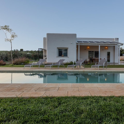 Take a dip in the pool or relax on a sun lounger