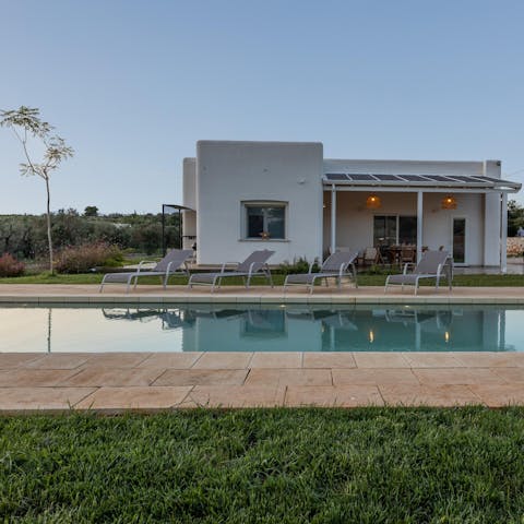 Take a dip in the pool or relax on a sun lounger