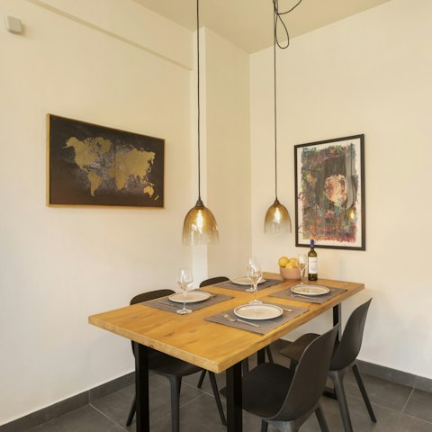 Gather around the wooden table to share a selection of Greek dishes