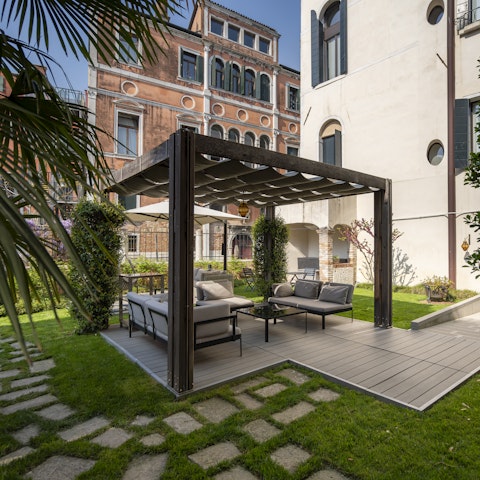 Savour a serene moment in the pretty shared garden