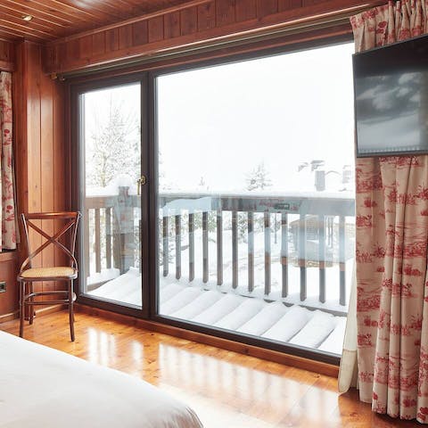 Step out onto a private balcony in the main bedroom