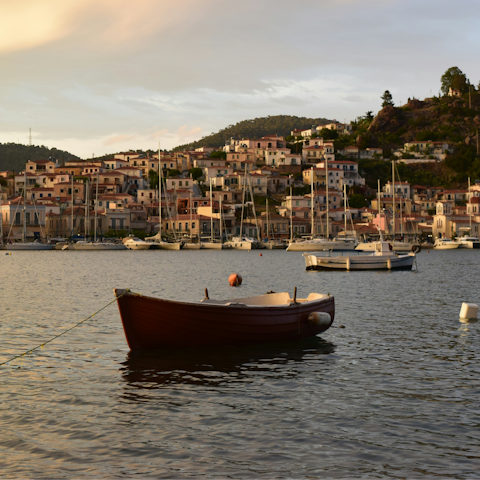 Visit the nearby port town of Poros for sunset drinks