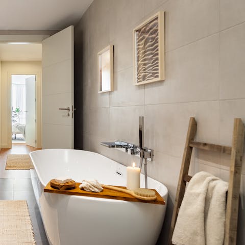 Treat yourself to an indulgent bubble bath in the freestanding tub