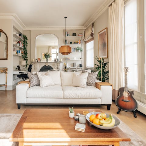 Unwind under gorgeous high ceilings in the living area