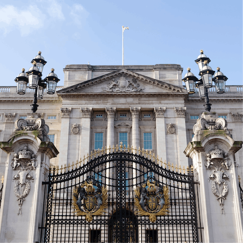 Visit iconic Buckingham Palace, a thirteen-minute stroll away