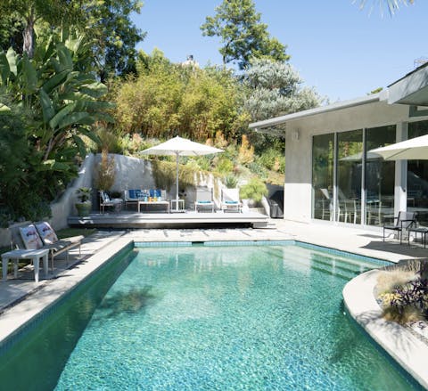 Float away your worries in the pool surrounded by foliage