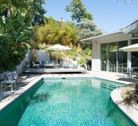 Float away your worries in the pool surrounded by foliage