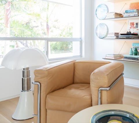 Relax in the library room on stylish mid-century furniture