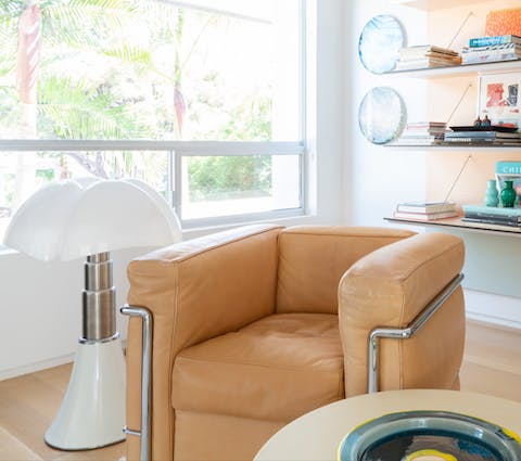 Relax in the library room on stylish mid-century furniture