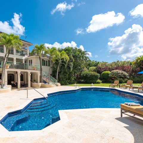 Take a cooling dip in the pool or sunbathe under the Caribbean heat