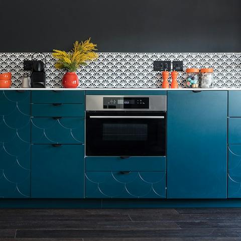 Fire up the coffee pod machine in the sleek, modern kitchen
