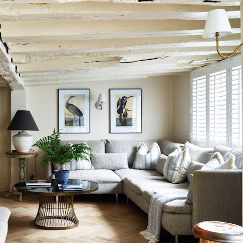 Get cosy under the beams in the rustic sitting room