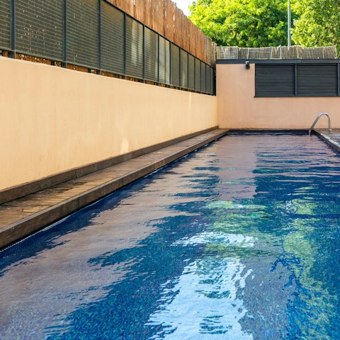 Take a refreshing dip in the shared swimming pool