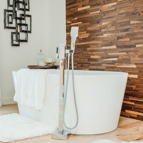 Soak away your stress in the freestanding bathtub