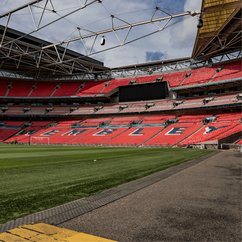 Take a thirty minute ride on public transport to Wembley Stadium, the home of English football