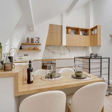 Enjoy a glass of wine and a charcuterie board around the dining table