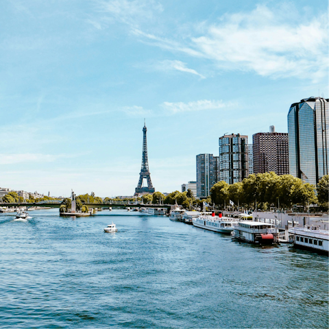 Walk down the banks of the Seine on a warm afternoon