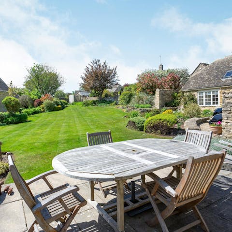 Dine alfresco as you look out over the generous landscaped gardens