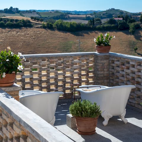 Enjoy a romantic soak in the Victorian bathtubs on the terrace