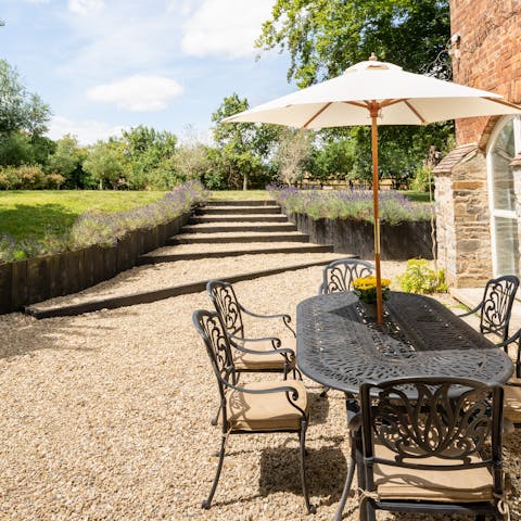 Dine alfresco overlooking the delightful gardens on sunny days