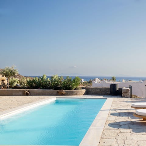 Admire the sparkling Aegean Sea with a dip in shared pool