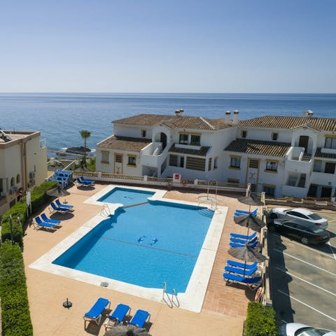 Swim in the communal pool to beat the Spanish heat