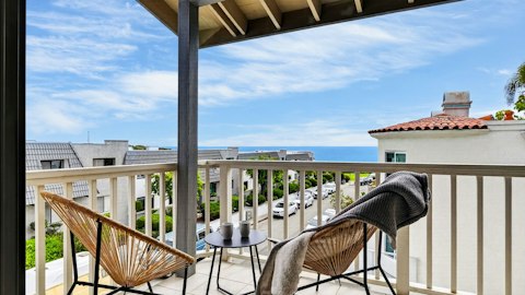 Sit back on the balcony as the ocean stretches out ahead