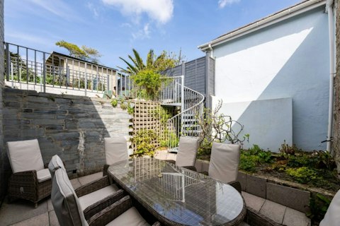Dine alfresco on the stone-walled terrace