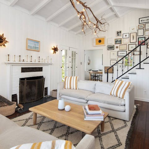 Spend afternoons snuggled up around the rustic fireplace