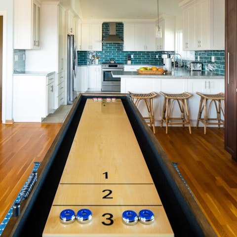 Call a shuffleboard tournament and keep the troops entertained