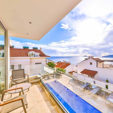 Enjoy breakfast on the balcony overlooking the Aegean