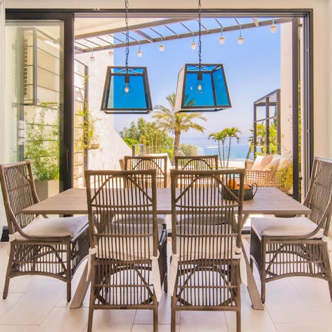 Enjoy dinners at your sleek dining table, under the glow of the lantern lights