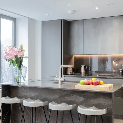 Chat at the breakfast bar and cook up a storm in the contemporary kitchen