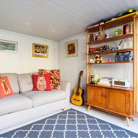 Relax in the separate studio at the back of the garden