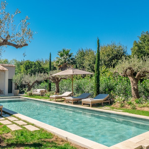 Stretch out poolside beneath the Riviera sun