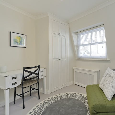 Catch up on emails from the home's inviting study