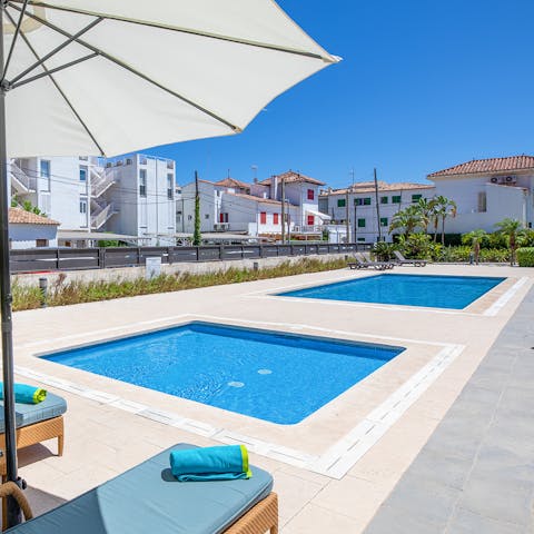 Take a refreshing dip in the shared swimming pool