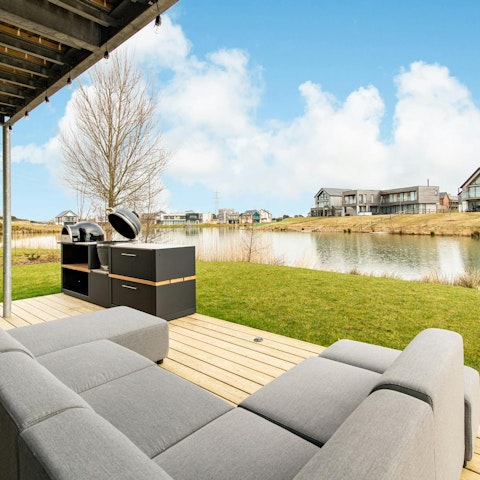Sip on an ice cold beer as you laze on the outdoor sofa with views of the lake