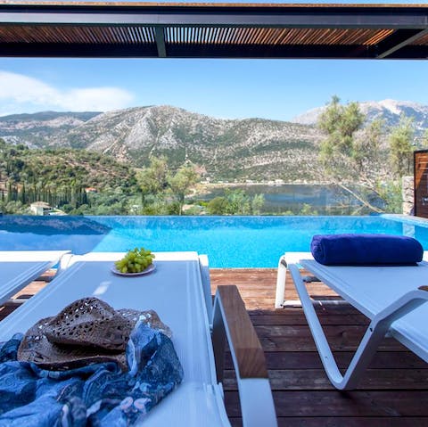 Sunbathe while taking in uninterrupted panoramic views of the surrounding mountains and seascape