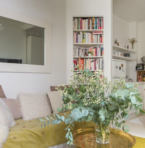 Choose a book from the mini library to curl up with after a day of exploring Paris