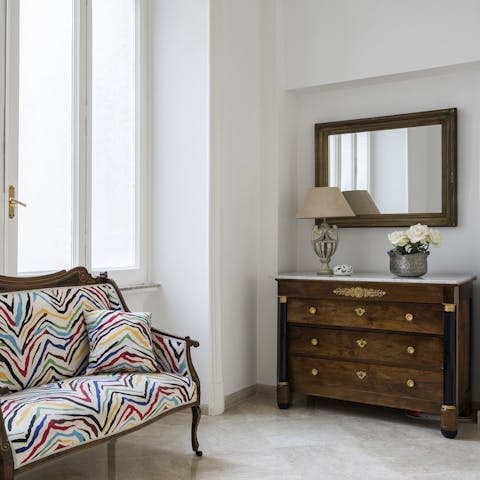 Find a relaxing reading spot on the elegant antique furniture