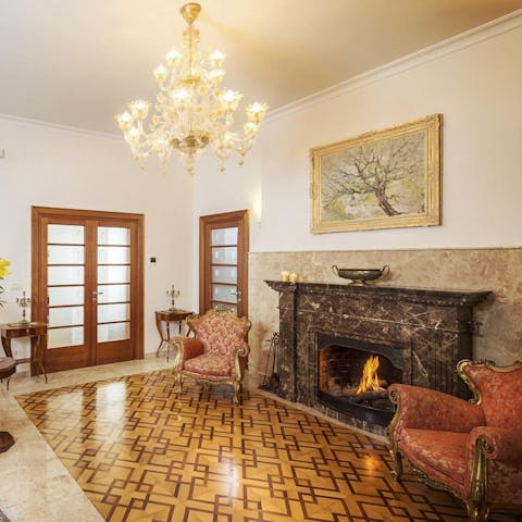 Get the period fireplace roaring on colder evenings and read in an adjacent armchair