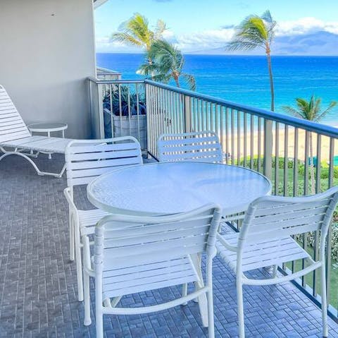 Enjoy your evening tipple to the sway of palm trees on the private balcony