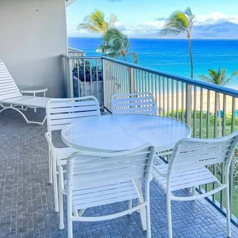Enjoy your evening tipple to the sway of palm trees on the private balcony