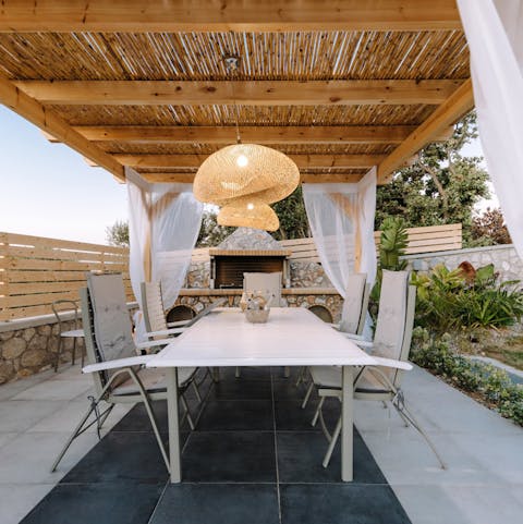 Shelter from the sun with plates of bread and hummus under the canopy