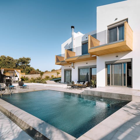 Swim in the fresh pool water under the warm glow of the sun