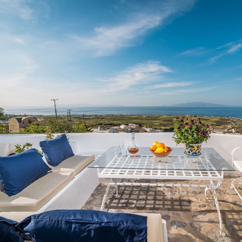 Dine and recline with a view of patchwork fields to the Aegean Sea