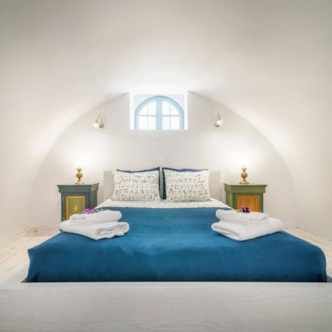 Embrace Santorini tradition in the cave-like bedrooms kept naturally cool